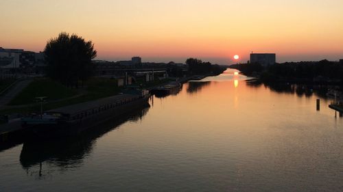 Scenic view of river at sunset