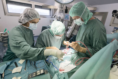 Neurosurgeons opening the cranium during an operation