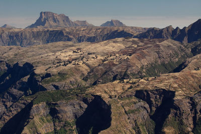 Aerial view of rocky mountains against sky