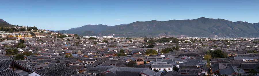 Panoramic shot of townscape against clear blue sky