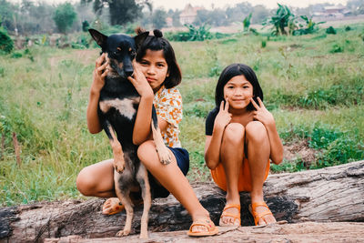 Portrait of friends sitting outdoors