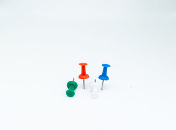 Close-up of colored pencils over white background