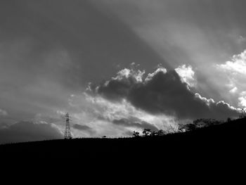 Low angle view of silhouette landscape against sky at dusk