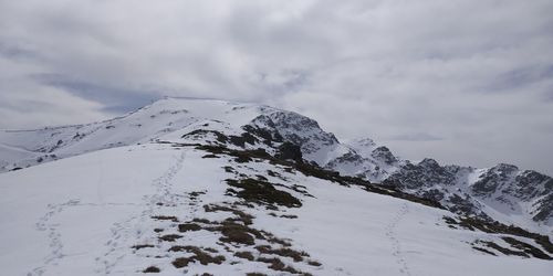 Snow covered mountain against sky