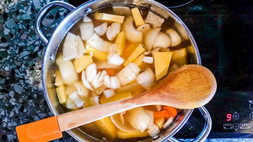 High angle view of vegetables in cooking utensil on stove at home