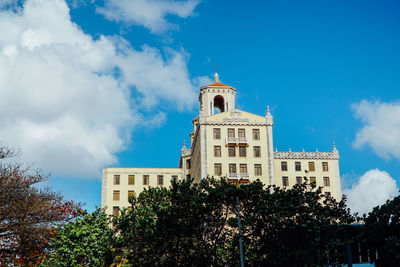 Low angle view of bell tower against sky