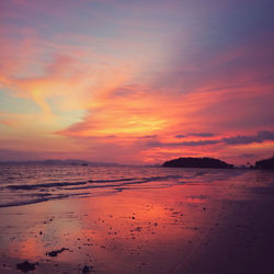 Scenic view of beach against sky during sunset