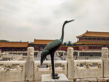 Statue of building against sky