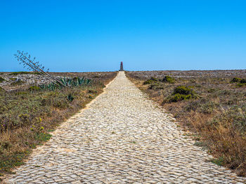 The long stone path leading to the lighthouse of ponta de sagres 