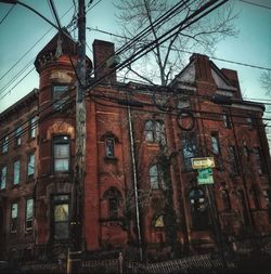 Low angle view of old building against sky