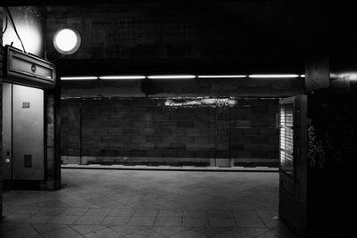 Illuminated lights on tiled floor in building