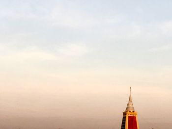 Temple against sky during sunset