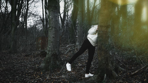 Side view of woman in forest