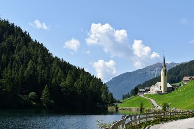 Scenic view of lake and mountains against sky