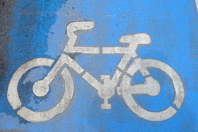 High angle view of bicycle symbol on footpath