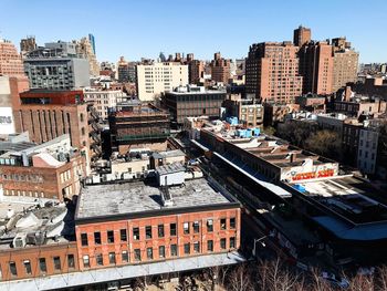 High angle view of buildings in city against clear sky