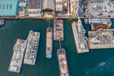 High angle view of sailboats moored at harbor