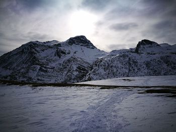 Scenic view of snowcapped mountains against sky