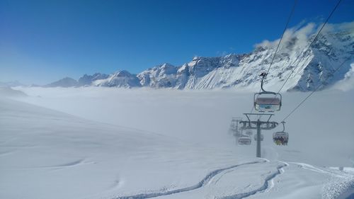 Snow covered mountains against clear sky