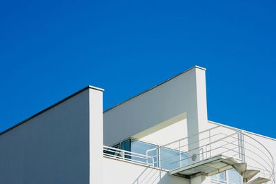 Low angle view of building against clear blue sky