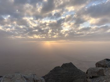 Scenic view of rock formation against sky during sunset