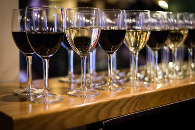 Close-up of wine glasses on table