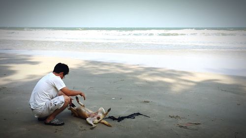 Full length of man on beach against sky