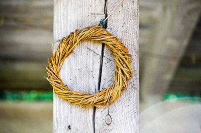 Close-up of rope tied on wooden post