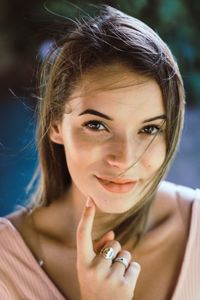 Close-up portrait of a smiling young woman