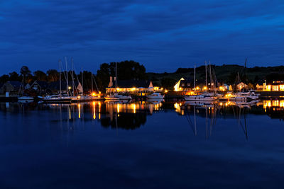 Sailboats in marina at night