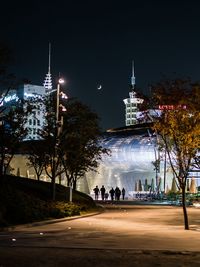 Illuminated city buildings at night