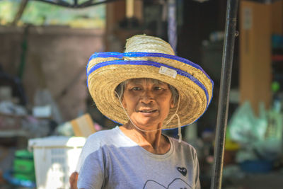 Woman wearing hat while standing outdoors