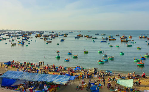 High angle view of people on beach against sky