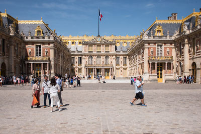 Group of people in front of historical building