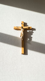 Close-up of crucifix hanging on wall