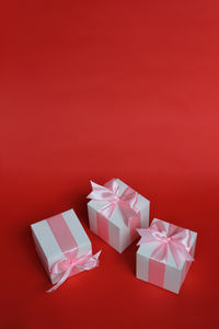 High angle view of gift box against yellow background