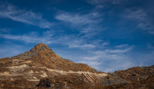 Scenic view of rocky mountains against sky