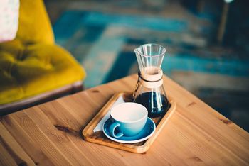 Close-up of white cup on table