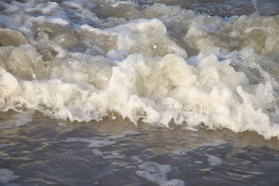 Full frame shot of waves rushing towards shore