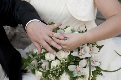 Cropped image of woman holding flower