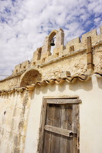 Low angle view of old building against sky
