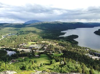 Scenic view of landscape and lake against sky