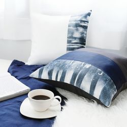 Close-up of coffee cup and book on table