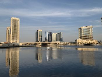 Modern buildings in city against sky