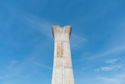Low angle view of statue against blue sky
