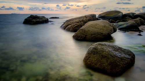 Scenic view of sea against sky at sunset