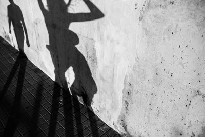 Low section of man walking on footpath