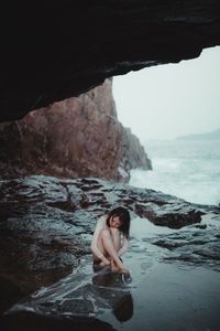 Woman looking at sea shore