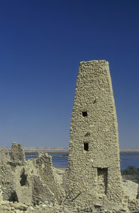 Low angle view of building against clear blue sky
