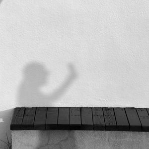 Shadow of hand on wall